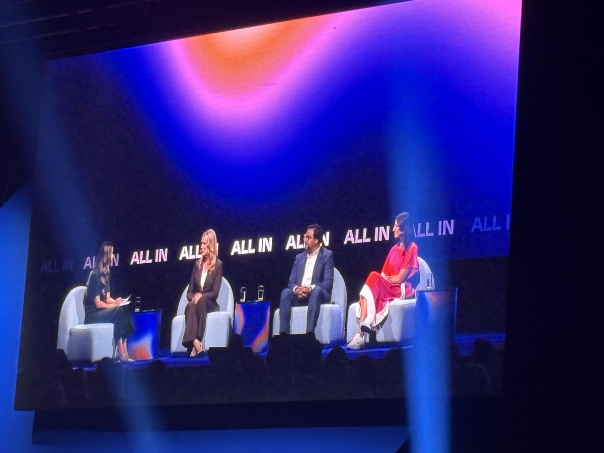 Panel discussion on the ALL IN conference stage